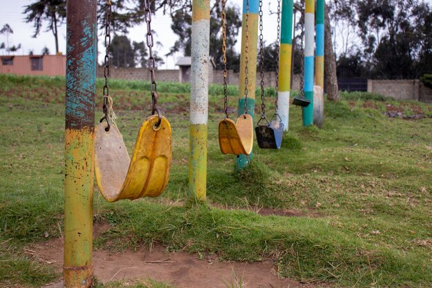 Park with a lot of old weathered chain swings