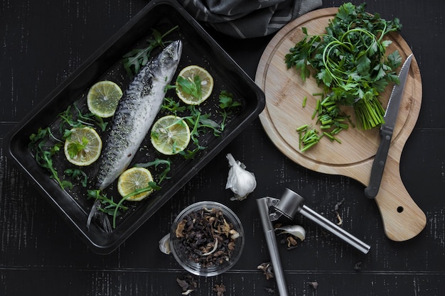 Parsley and spices near raw fish