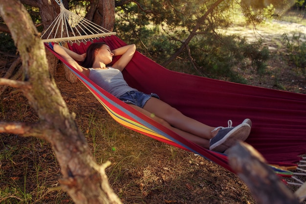 Free Photo party, camping. woman sleeping at forest. she relaxing