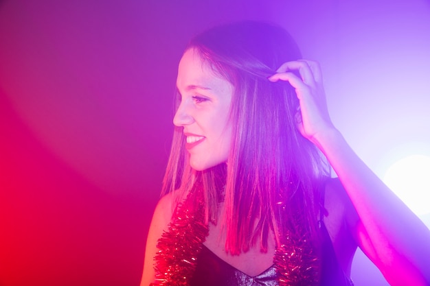 Free photo party concept with girl touching her hair