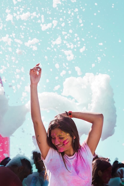 Party foam over the girl dancing in at holi celebration