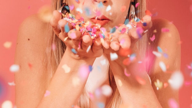 Party girl posing with confetti