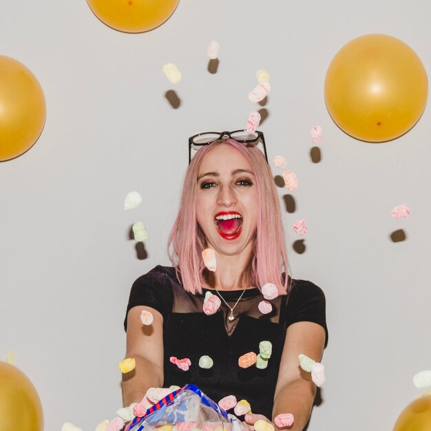 Party girl with confetti having fun