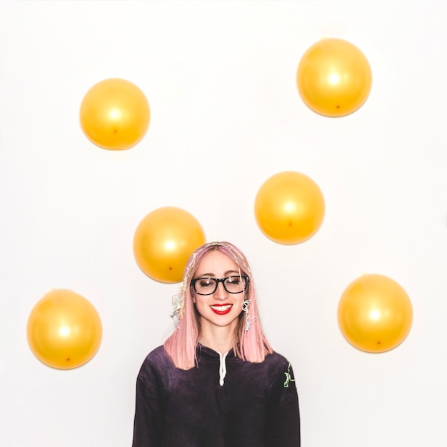 Free photo party girl with yellow balloons