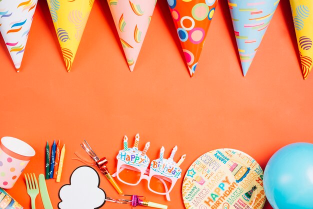 Party hats near birthday supplies