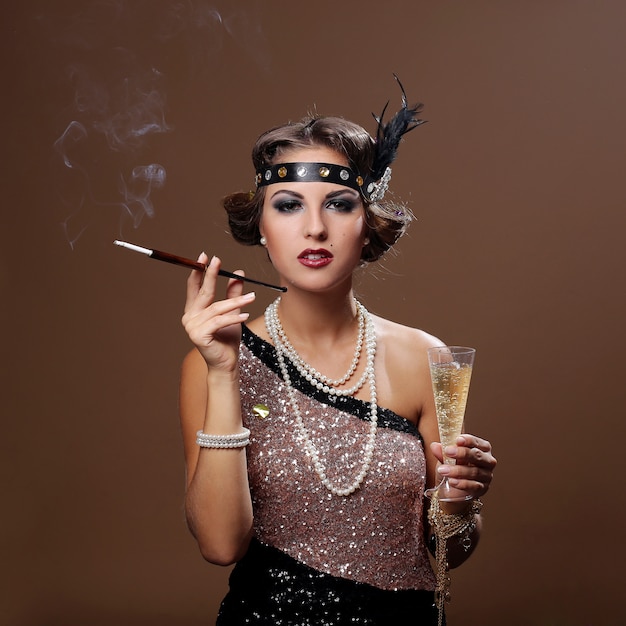 Free photo party woman with brown background, smoking