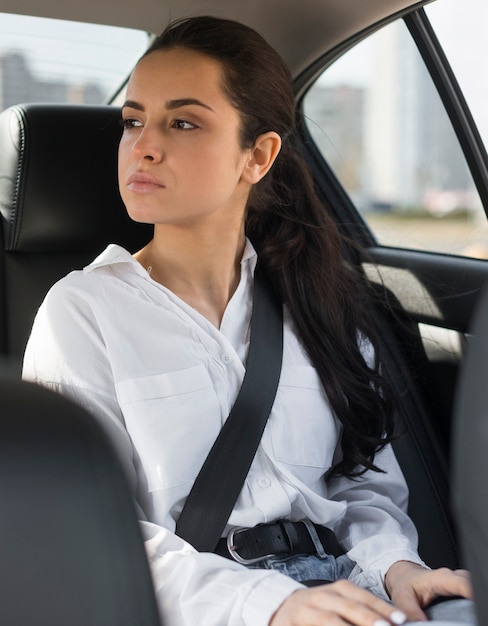 Passenger sitting in the car and looking through the window