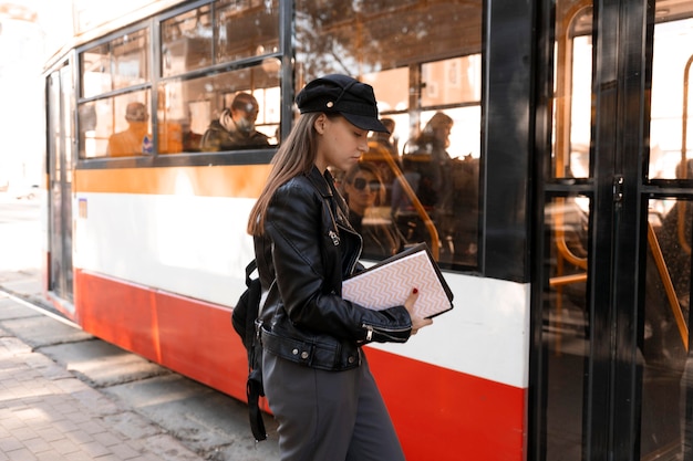 Free photo passenger waiting in the station for the tram