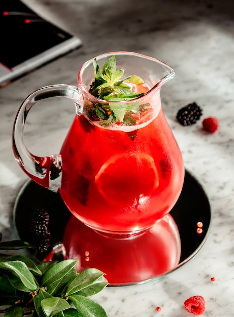 Passion fruit lemonade with basil on the table