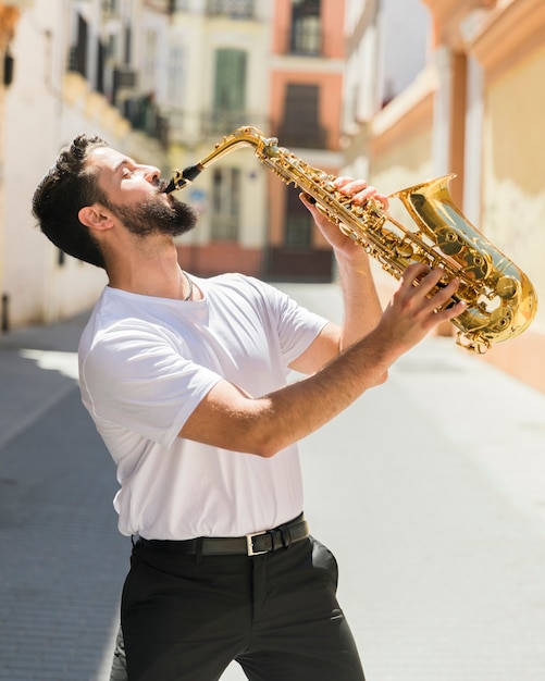 Free Photo passionated musician performing in street