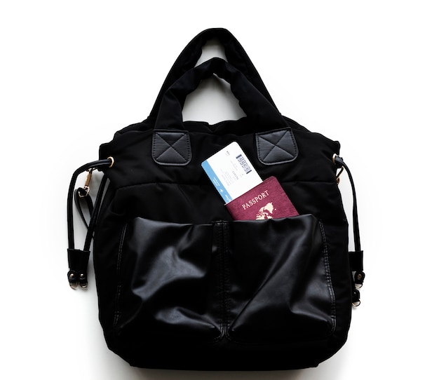 Free Photo passport and boarding pass in a handbag