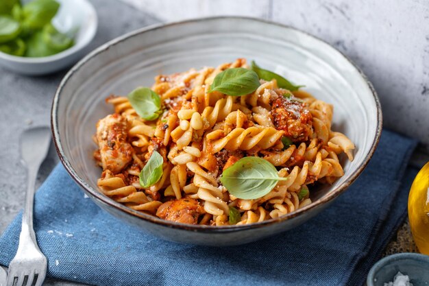 Pasta with tomato sauce served in bowl