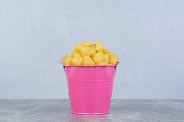 Pastas isolated in a colorful metallic bucket