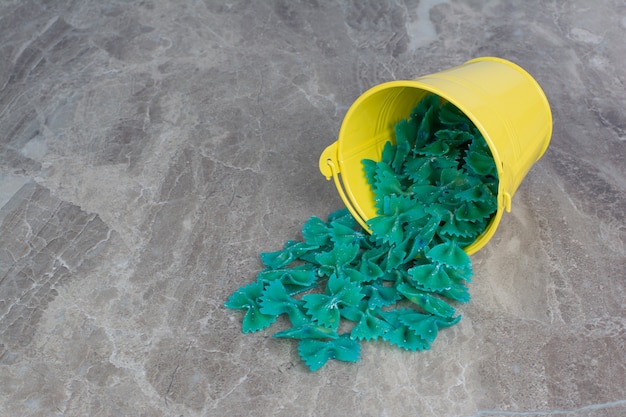 Pastas isolated in a colorful metallic bucket