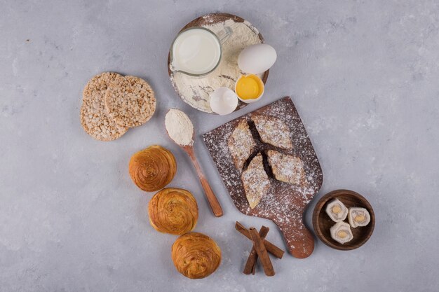 Pastry making with ingredients on a stone table