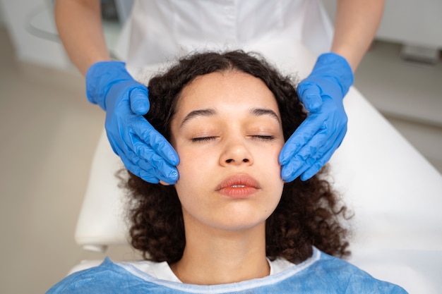 Patient undergoing microneedling procedure