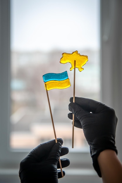 Patriotic lollipops in the form of ukrainian symbols