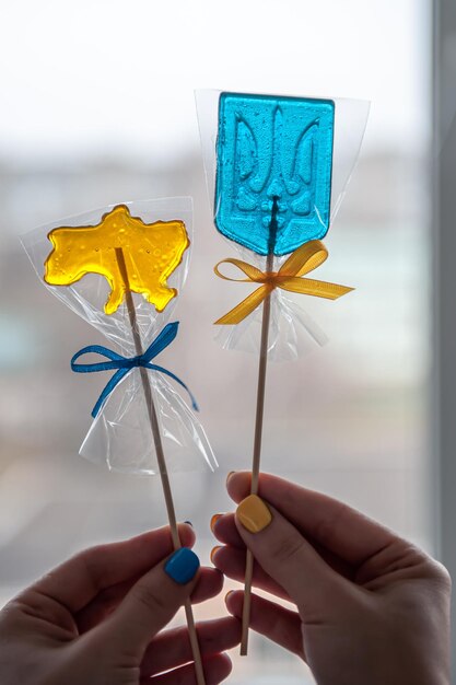 Patriotic lollipops in the form of ukrainian symbols