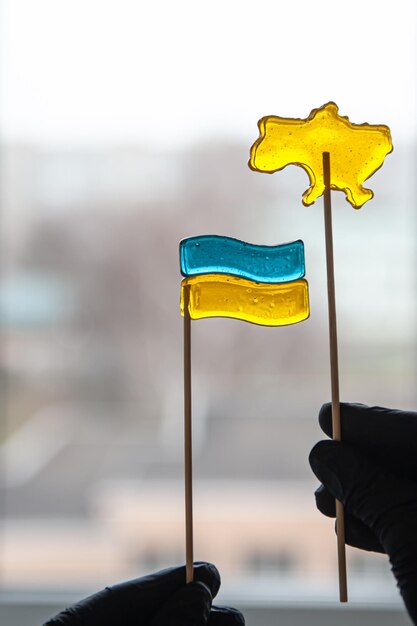 Patriotic lollipops in the form of ukrainian symbols