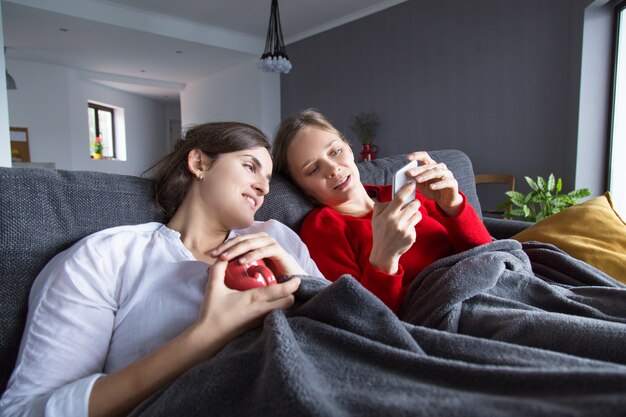 Peaceful gay couple enjoying weekend at home