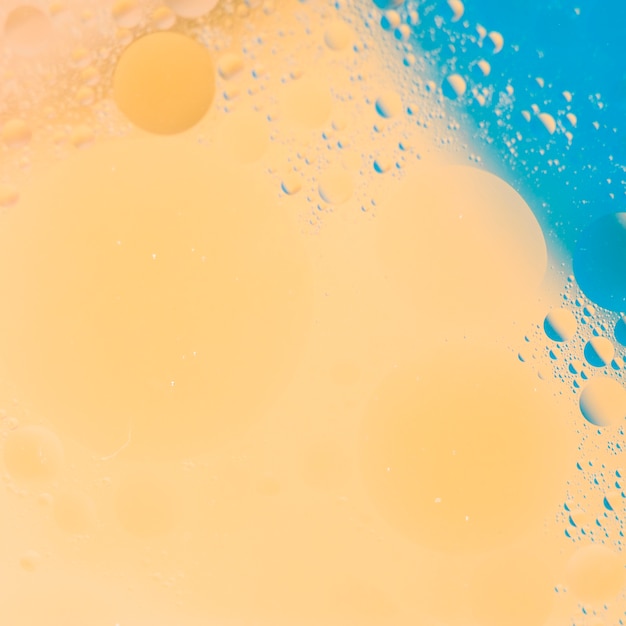 Free photo peach and blue paint background with bubble textured