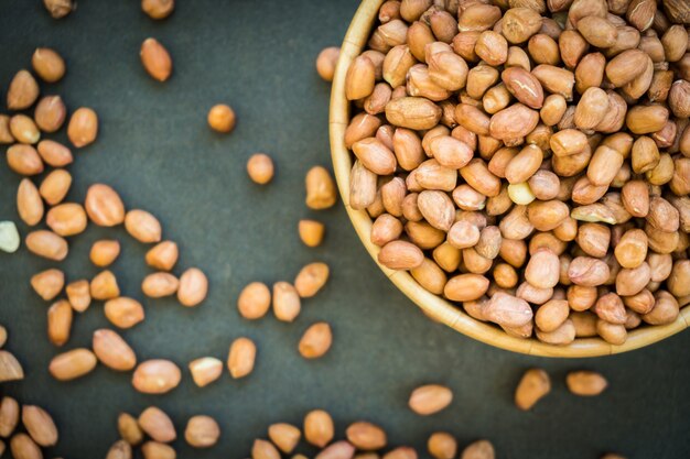 Peanuts in wooden bowl