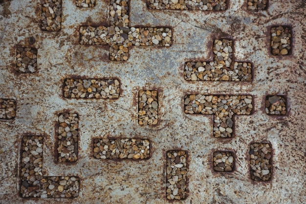 Pebbles in hollow metal pattern