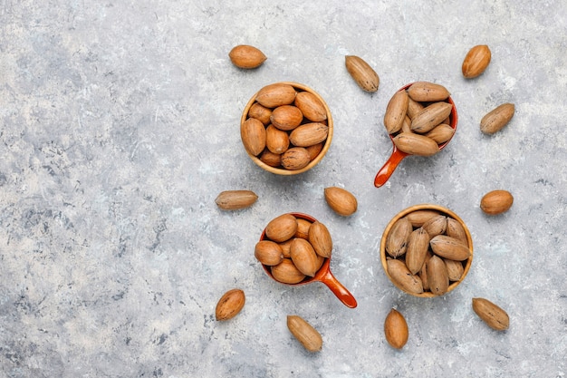 Pecan nuts on light background,top view