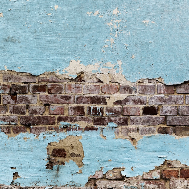 Free photo peeled painted brick walls texture