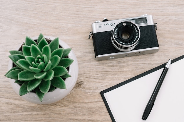 Free photo pen on a notebook with a camera