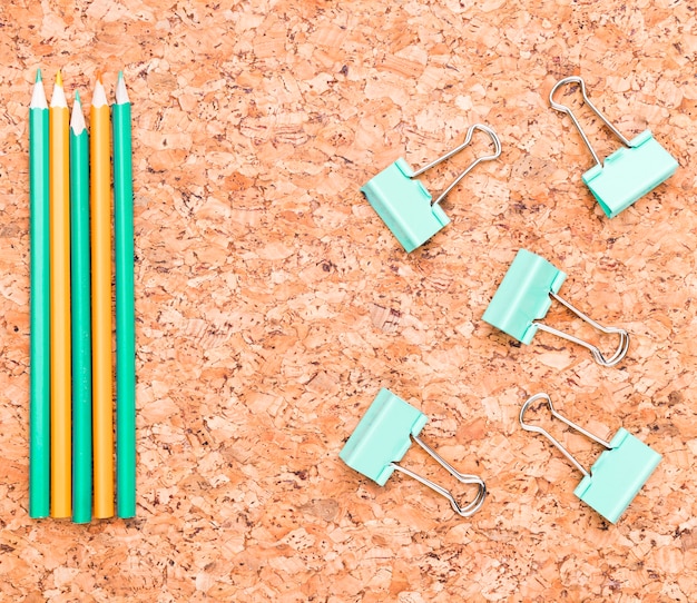 Pencils and binder clips on desk