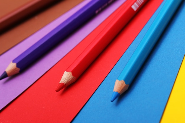 Free photo pencils on colorful paper