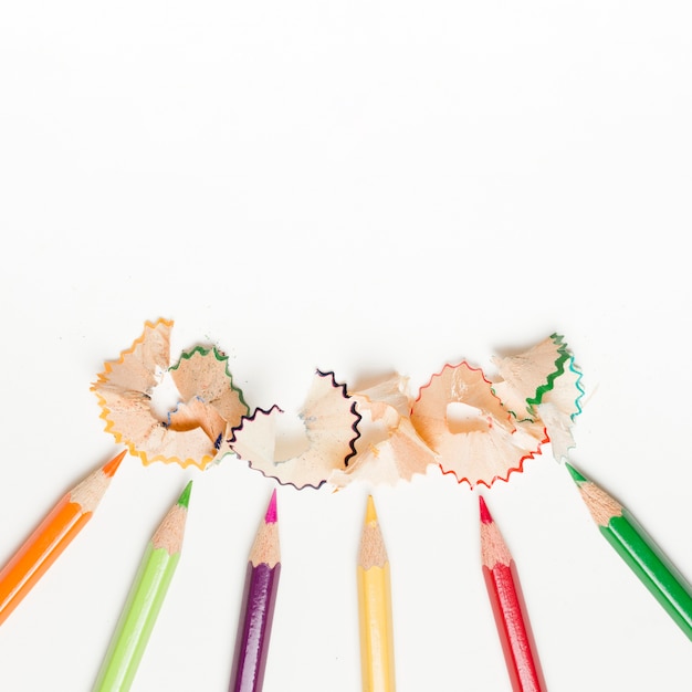 Free photo pencils and pencil shavings on white background