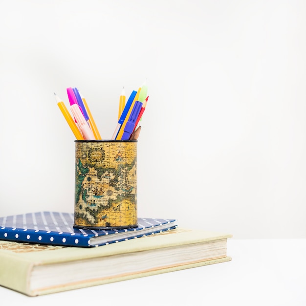 Free Photo pencils on pile of notebooks