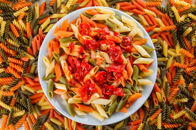 Free photo penne pasta in a plate with tomatoc sauce