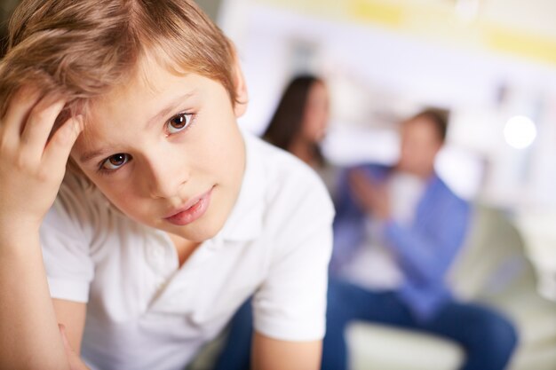 Pensive boy with white t-shirt