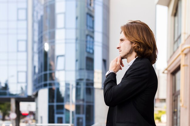 Pensive businessman looking away