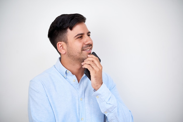 Pensive businessman with phone