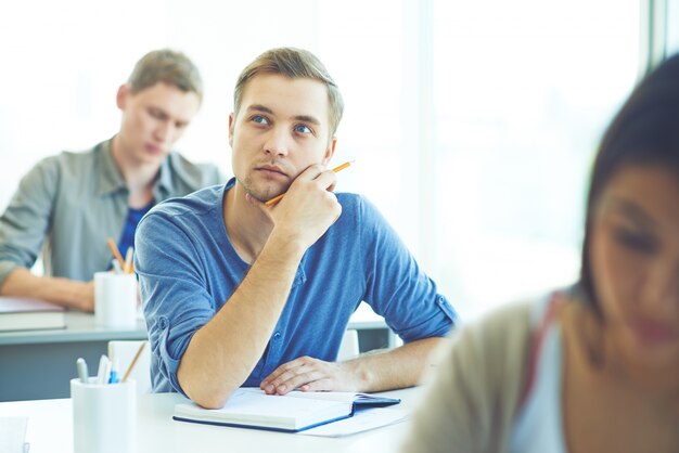 Pensive guy at class