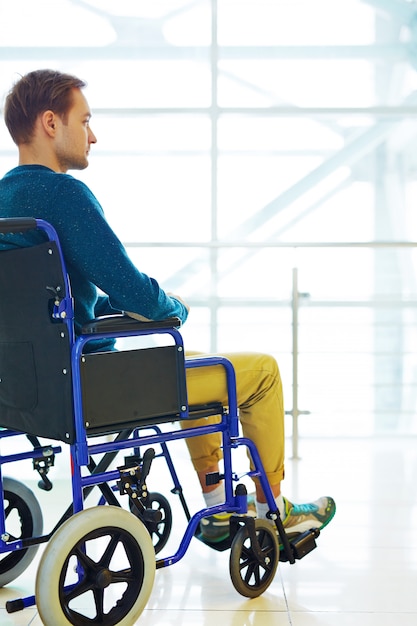 Pensive man in wheelchair