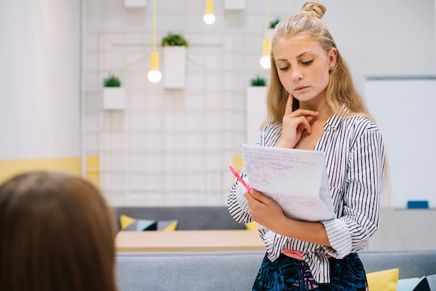 Free photo pensive student thinking on studies