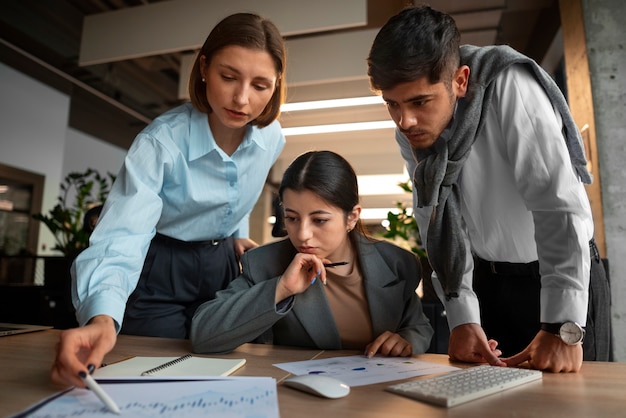 People analyzing and checking finance graphs in the office