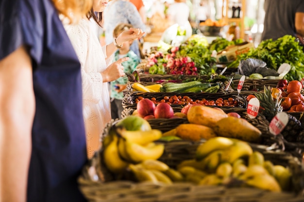 Free Photo people buying vegetable on stall at the market