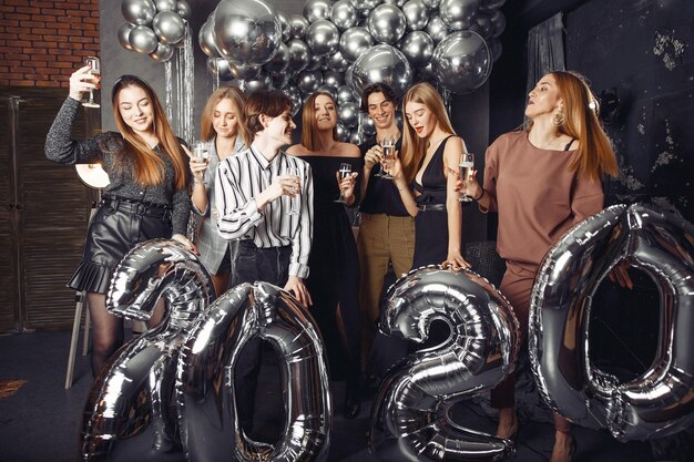 People celebrating a new year with a big ballons