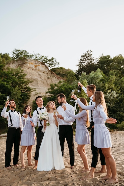 Free Photo people celebrating a wedding on the beach