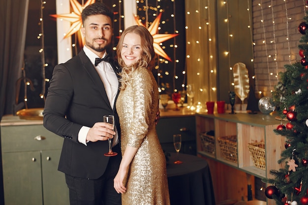 Free Photo people in a christmas decorations. man in a black suit.