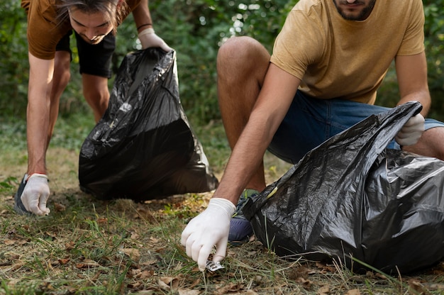 Free Photo people cleaning garbage from nature