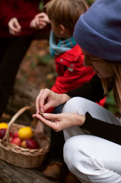 Free photo people collecting food from the forest