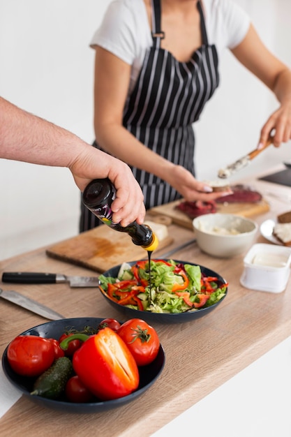 People cooking together close up