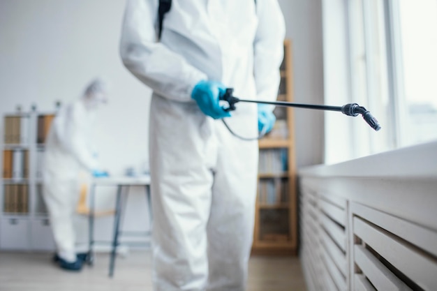 People disinfecting a biohazard area